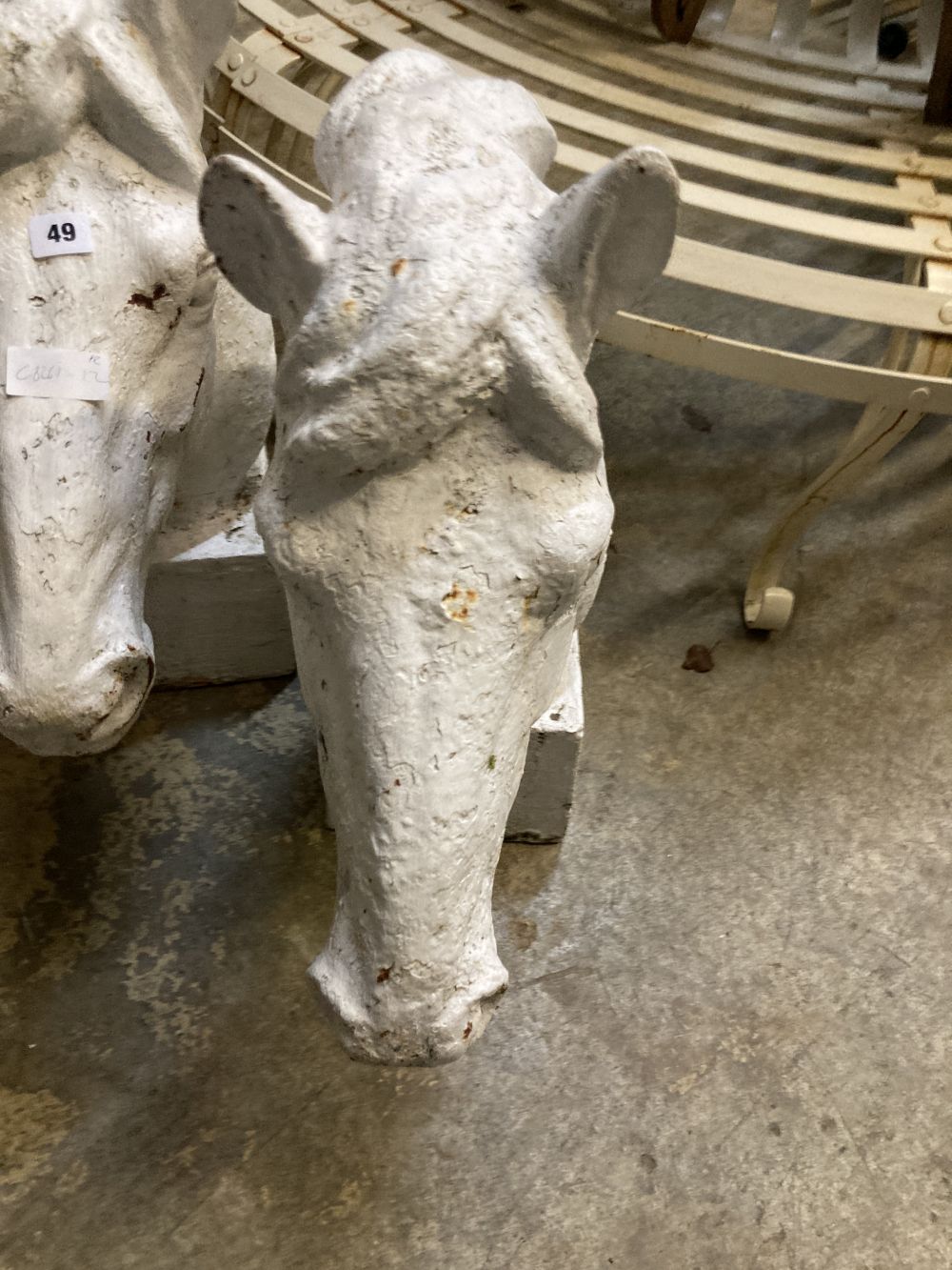 A pair of Victorian painted cast iron horse head garden ornaments, height 62cm